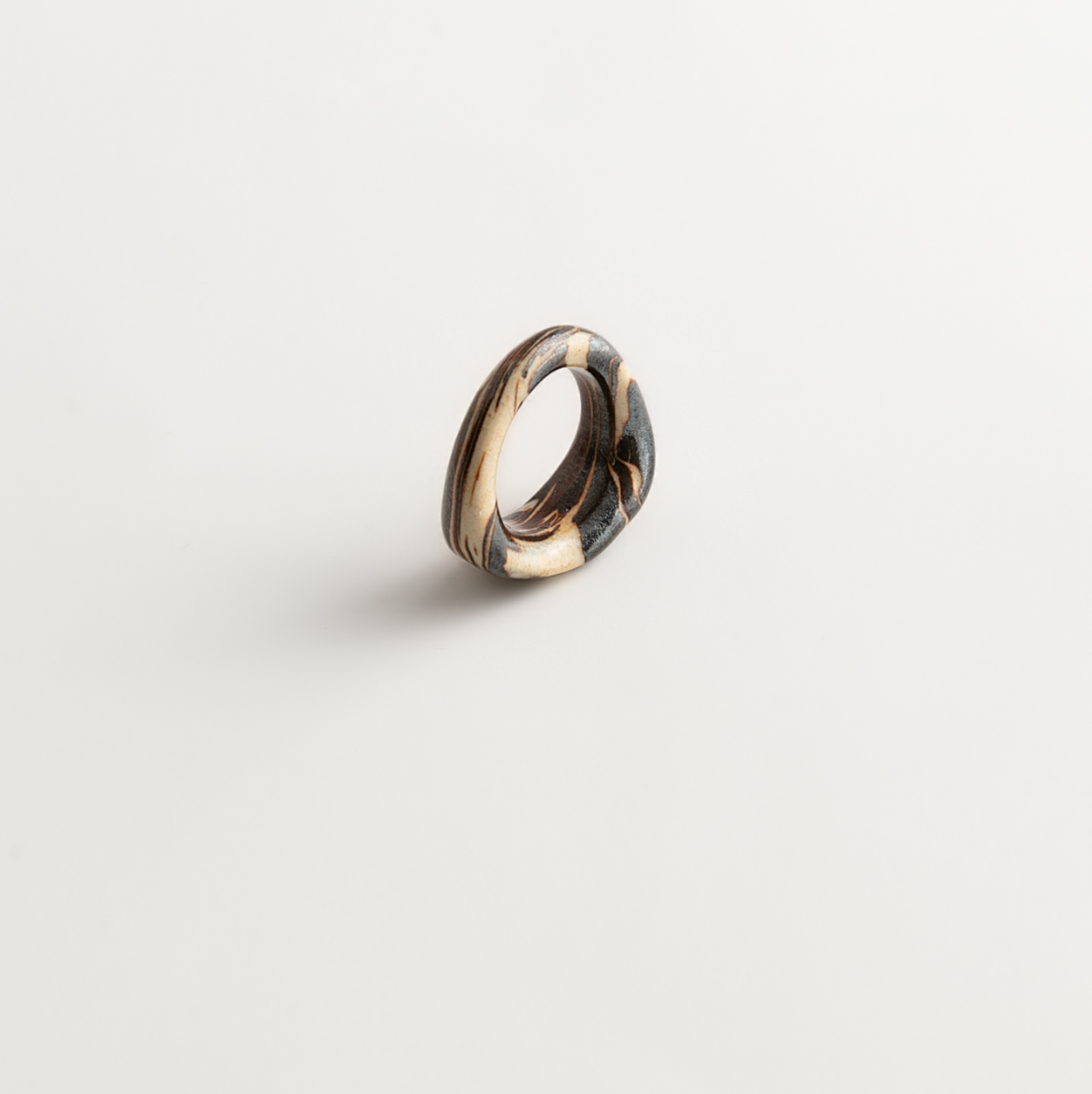 Artisan Nerikomi Ceramic Ring – Ink & Ivory Flow, Sculptural Band